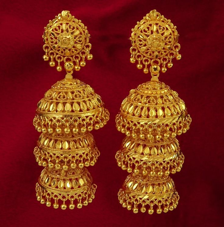 present beautiful gold earrings with unique design…